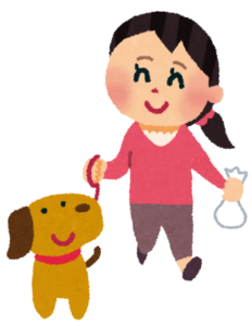 うんち袋を持っている散歩している犬と飼い主